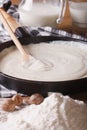 Preparation of bechamel sauce in a pan, vertical