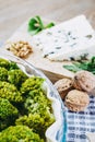 Preparation of a broccoli pie with Roquefort cheese and nuts