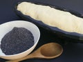 Preparation of buchty , traditional Czech sweet buns made of yeast dough - filling with ground poppy seeds and curd