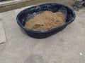 Preparation of a certain amount of sand for mortar mixing work at a construction site Royalty Free Stock Photo