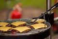 Preparation of cheeseburgers on family BBQ day Royalty Free Stock Photo