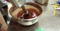 Preparation of chocolate mousse using an immersion blender in a professional kitchen. Royalty Free Stock Photo