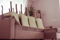 Preparation for cleaning the floor in the apartment. Raised the chairs and put them on sofa Royalty Free Stock Photo