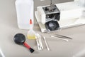 Preparation for cleaning sewing machine. Royalty Free Stock Photo