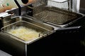 Preparation in a deep fryer. Fresh Falafel balls fries in hot fa