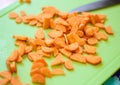 Preparation of dishes from sliced fresh carrots. Royalty Free Stock Photo