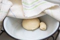 Preparation of dough for making dumplings, ravioli, manti, dumplings. Dough in a plate under a towel Royalty Free Stock Photo