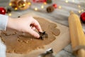 Preparation of festive christmas gingerbread cookies. Raw dough, cutting cookie and holiday decoration Royalty Free Stock Photo