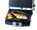 Fish and vegetables on electric grill Royalty Free Stock Photo