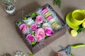 Preparation of flower box with macaroons Royalty Free Stock Photo
