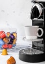 Preparation of fresh morning coffee from espresso machine with pods on white background Royalty Free Stock Photo