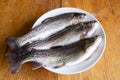 Preparation of fresh trout for cooking. Royalty Free Stock Photo