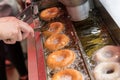 Preparation of fried donuts in a hot oil