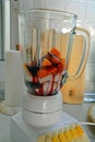 Preparation of healthy fresh smoothie with blueberry and papaya fruits.