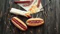 preparation of hot dogs with sausage.photo on a wooden backgroun Royalty Free Stock Photo