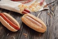 Preparation of hot dogs with sausage.photo on a wooden background Royalty Free Stock Photo