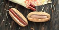 Preparation of hot dogs with sausage.photo on a wooden background Royalty Free Stock Photo