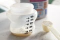 Preparation of infant formula for feeding the child. Feeding bottle. Selective focus.