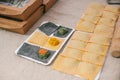 Preparation of Italian dish Ravioli. This is pasta from dough with different fillings. An analog of ravioli is dumplings