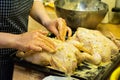 Preparation of large chicken for baking for a festive dinner.