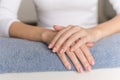 Preparation for manicure. The hands of a young girl lie on a classic blue towel on the table. Nude manicure. Hand care