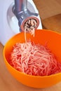 Preparation of minced meat using a meat grinder. Royalty Free Stock Photo