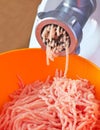 Preparation of minced meat using a meat grinder. Royalty Free Stock Photo