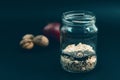 Preparation overnight breakfast with flakes of oats, chia, apple