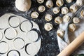 Preparation of pelmeni. Top view. Ingredients on black table. Traditional Russian cuisine. Royalty Free Stock Photo