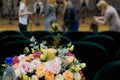 Preparation for the performance at the vocal competition. People are preparing to sing at the gala concert. Bouquet of flowers on