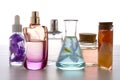 Preparation of perfumes from natural ingredients, aromatherapy. Fresh flowers in chemical flasks and perfume bottles