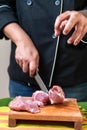 Pork meat preparation for cochinita tacos with Mexican chef