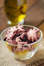 Preparation potato salad with pickled octopus and onions Royalty Free Stock Photo