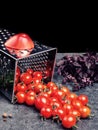 Preparation recipe tomato juice. Large tomato and old grater down to small grape cherry tomatoes on retro vintage rustic gray ston Royalty Free Stock Photo