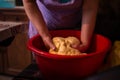 Housewife kneading the dough by hand. preparation of the recipe for traditional Romanian homemade cakes known as cozonac Royalty Free Stock Photo