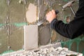 Preparation of repair the bathroom. Man Removing old tiles Royalty Free Stock Photo