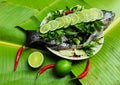 Preparation of streaming Nile Tilapia fish with lemon topping delicious menu for everyone on holiday, Song Kran festival.