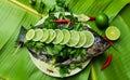 Preparation of streaming Nile Tilapia fish with lemon topping delicious menu for everyone on holiday, Song Kran festival.