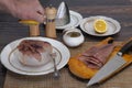 Preparation of stroganina on the ice dish,