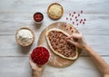 Preparation of traditional Arabic pizza manaqish with meat. Royalty Free Stock Photo