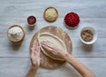 Preparation of traditional Arabic pizza manaqish with meat. Royalty Free Stock Photo