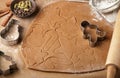 Preparation of a traditional gingerbread. Christmas. New year. The dough and cutting the cookie on the table Royalty Free Stock Photo