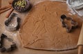 Preparation of a traditional gingerbread. Christmas. New year. The dough and cutting the cookie on the table Royalty Free Stock Photo