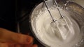 Preparation of traditional Sardinian sweets whisk the egg white