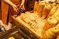 Preparation of the traditional TrdelnÃÂ­k a kind of spit cake made from rolled dough wrapped around a stick, grilled Royalty Free Stock Photo