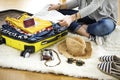 Preparation travel suitcase at home Royalty Free Stock Photo