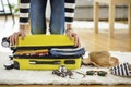 Preparation travel suitcase at home Royalty Free Stock Photo