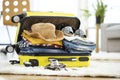 Preparation travel suitcase at home Royalty Free Stock Photo