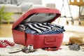 Preparation travel suitcase at home Royalty Free Stock Photo