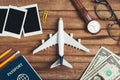 Preparation for Traveling concept, pencil, money, passport, airplane, watch, eyeglasses, photo frame. Royalty Free Stock Photo